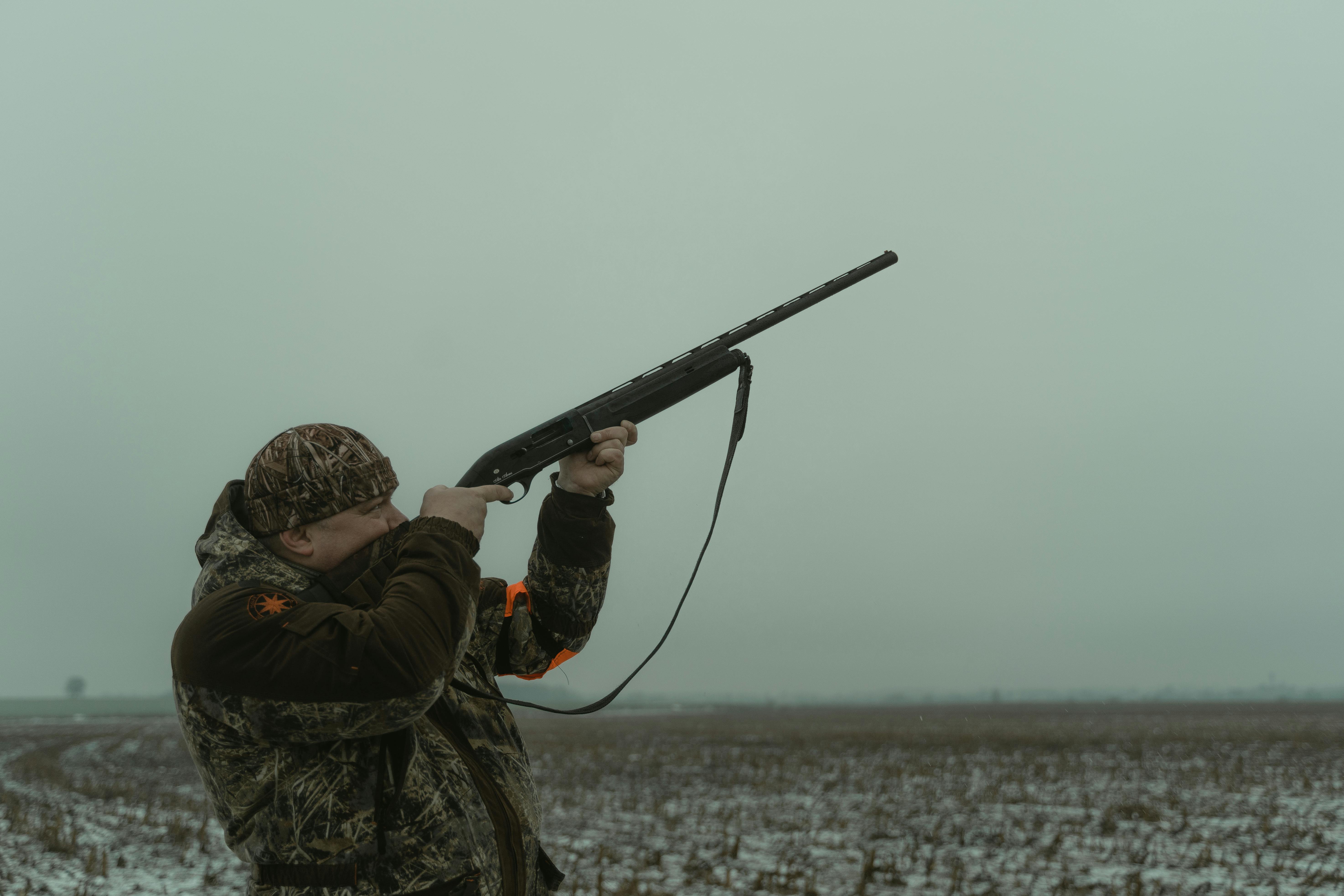 Hunter standing in a field